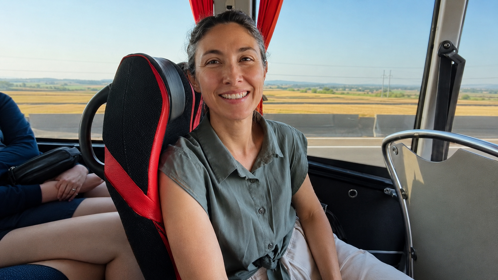 smiling woman riding in bus